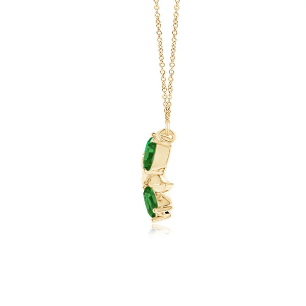 Natural emerald tree branch pendant necklace in 14K yellow gold, featuring 0.85ct emerald, 1.5-inch length.