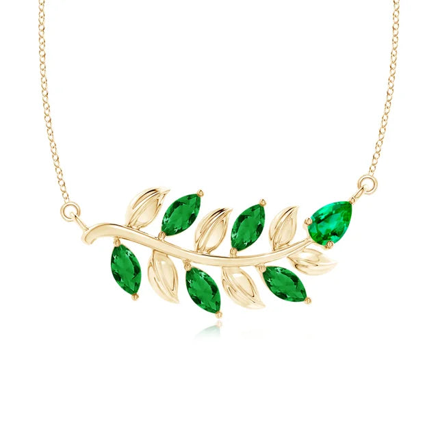 Emerald branch necklace in 14k yellow gold, featuring nature-inspired design by Irdoja Diamonds.