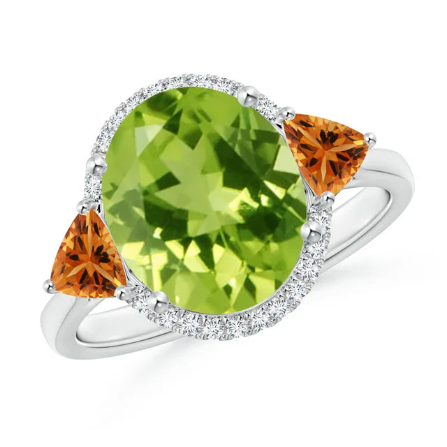 Oval peridot center stone with trillion citrine accents and diamond halo in 18k white gold ring by Irdoja Diamonds.