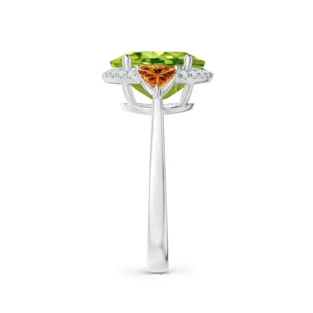 Oval peridot center stone with trillion citrine accents and diamond halo in 18k white gold ring by Irdoja Diamonds.