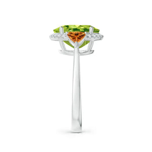 Oval peridot and trillion citrine diamond cocktail ring in 18k white gold by Irdoja Diamonds.