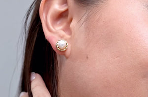 Solitaire Freshwater Pearl Twist Rope Stud Earrings showcased on model's ear, highlighting the pearl and rope detailing.