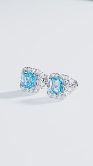 Film of the 4.00ctw Fancy Intense Blue lab-grown diamond halo studs