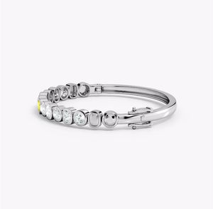 Bezel-Set Multi-Shape Lab-Grown Yellow and White Diamond Bangle showcasing yellow and white diamonds in bezel settings.