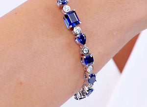 Blue Sapphire & Diamond Multi-Shape Tennis Bracelet showcasing vibrant blue sapphires and brilliant diamonds.
