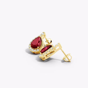 Lab-Grown Pear Ruby Earrings with Diamond Swirl Frame featuring pear-shaped ruby and diamonds in gold setting.