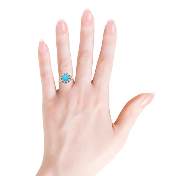 Round turquoise ring with triple split shank and diamond halo in 18k yellow gold by Irdoja Diamonds.