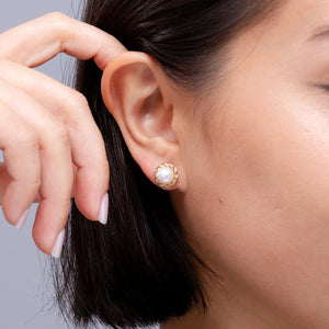 Solitaire Freshwater Pearl Twist Rope Stud Earrings worn by a woman, showcasing lustrous pearl and intricate rope design.