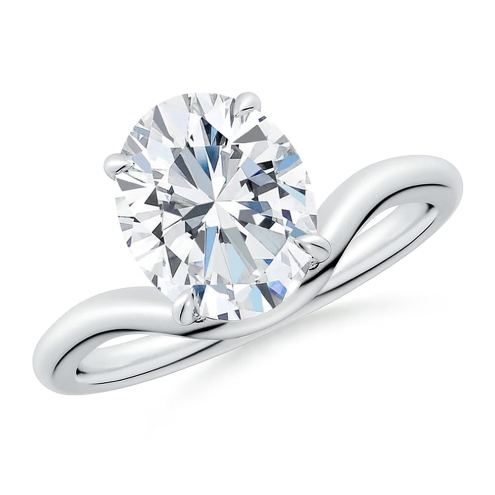 Solitaire oval lab-grown diamond engagement ring with curved shank in 18K yellow gold by Irdoja Diamonds.