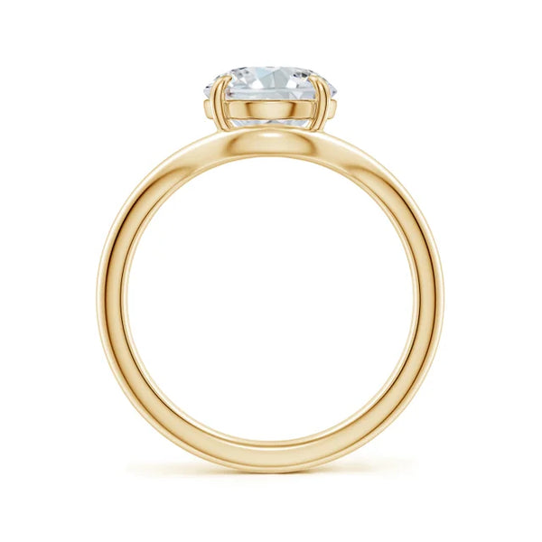 Oval lab-grown diamond engagement ring with curved shank in 18K yellow gold by Irdoja Diamonds.